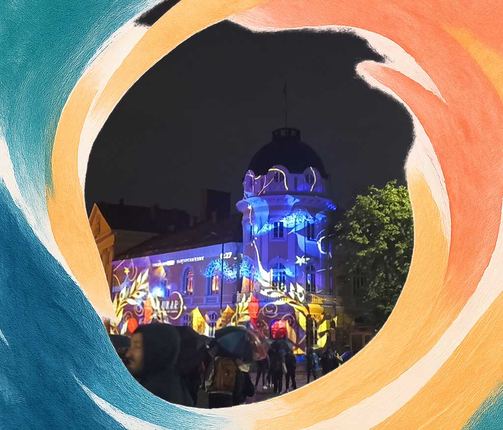 A building in Sofia, Bulgaria, illuminated by various spotlights that bring its facade to life and create a spectacle.